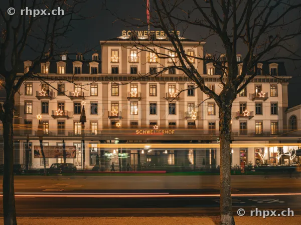 Hotel Schweizerhof in Lucerne at night with illuminated stars on the facade