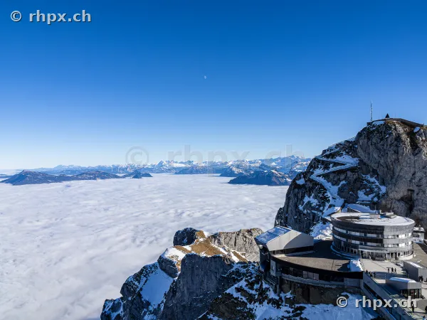 View from Pilatus Kulm mountain station looking over a dense sea of fog in the Alps