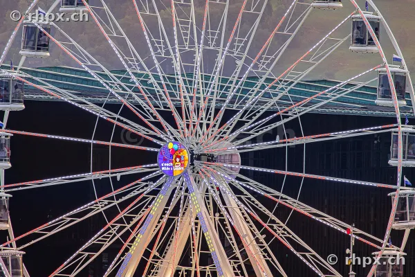 Ferris wheel with illuminated center at the Lucerne Autumn Fair